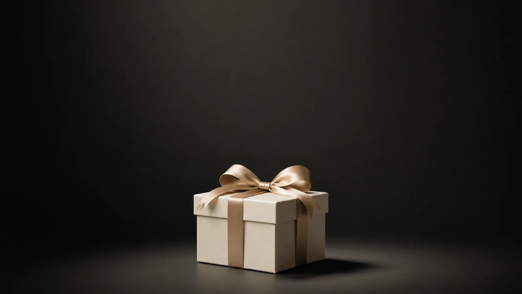 A cream gift box tied with satin ribbon